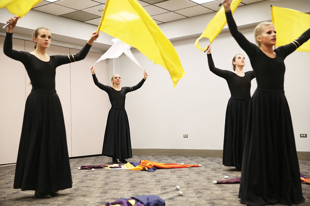 the color guard rehearsed the matching movements